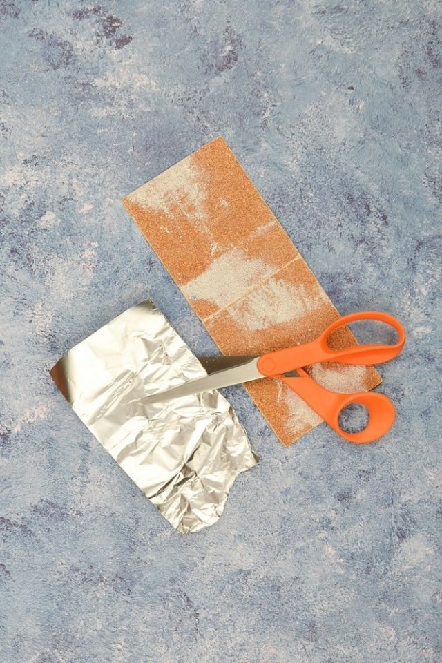 cut scissors into aluminum foil and sandpaper