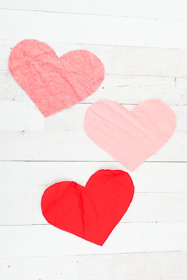 cut out three pink and red hearts