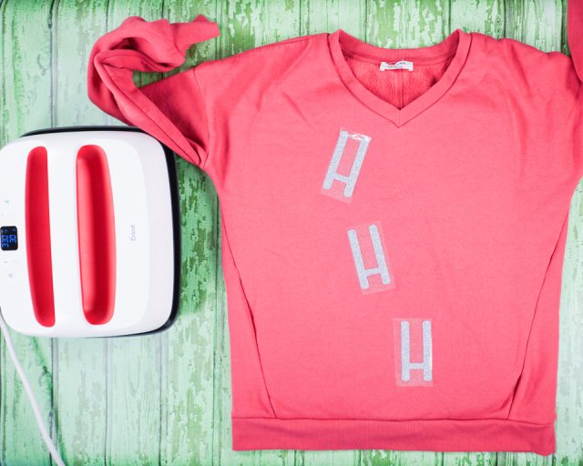 place "h's" on the front of sweater