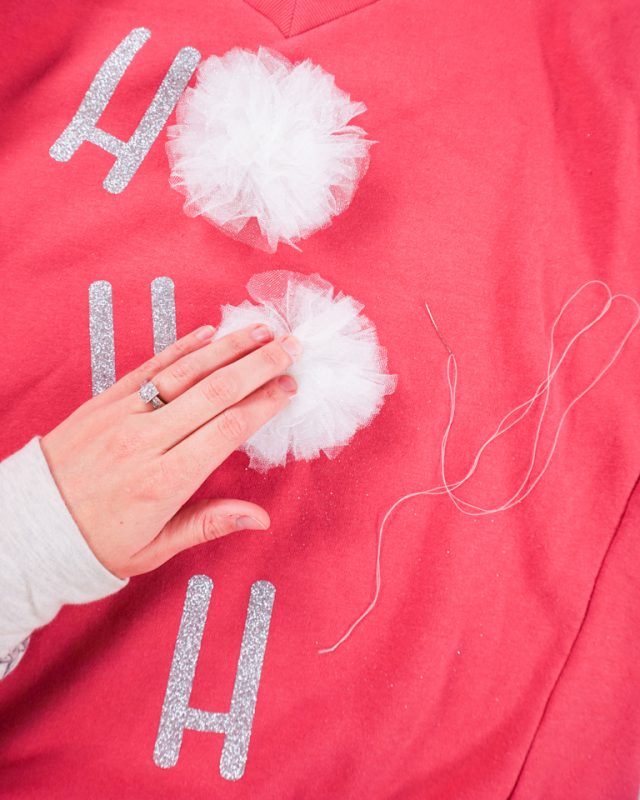 hand sew pompoms to sweater