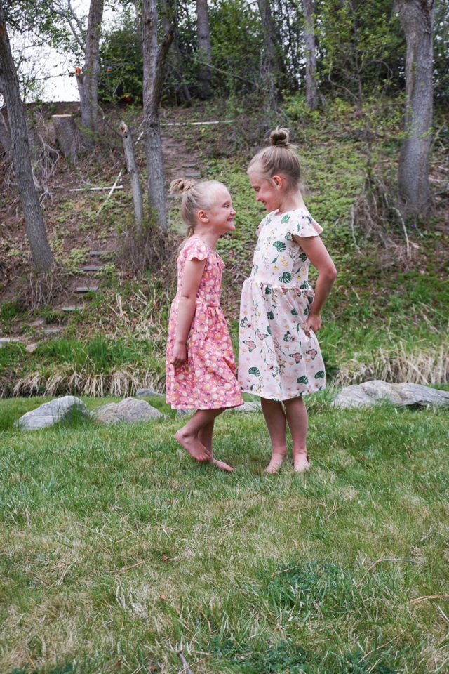 two girls wearing babydoll dresses