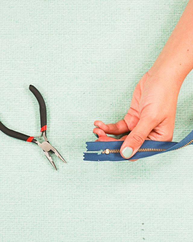 bend prongs around zipper