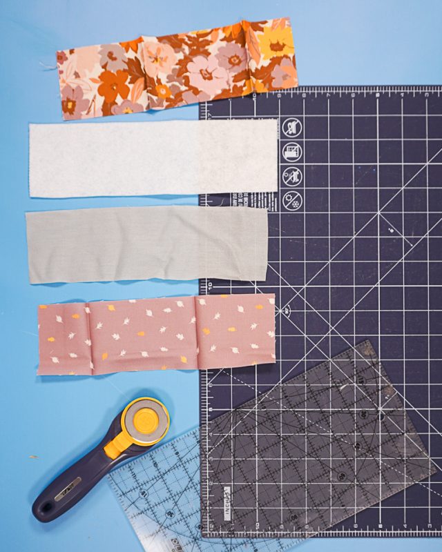 cut out two rectangles of fabric, one interfacing rectangle, and one fusible fleece rectangle