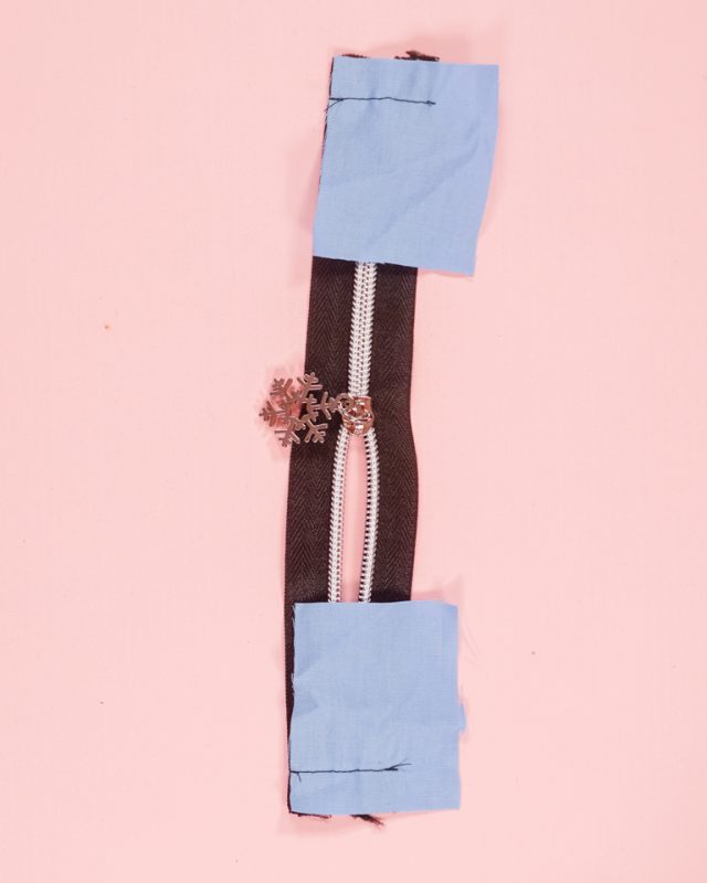 sew zipper tabs onto each end of zipper
