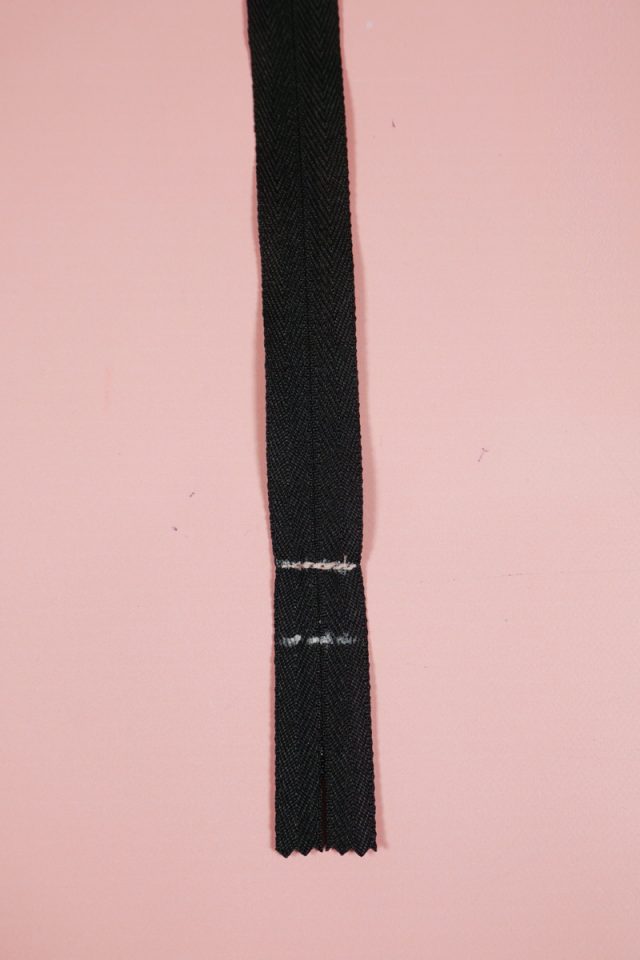 sew across new end of zipper