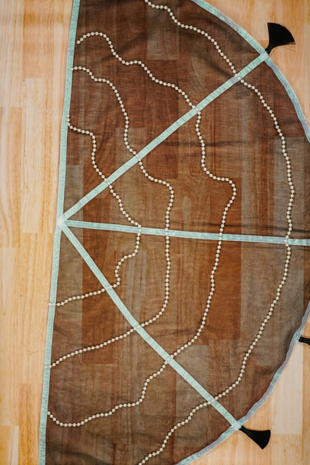 cut out pearl strands to hang in a half circle