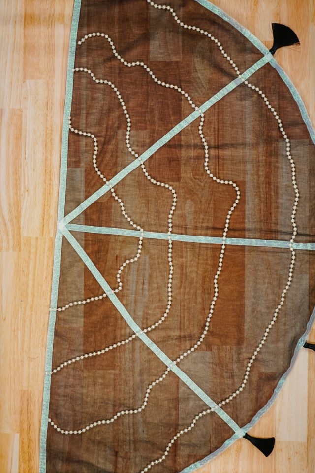 cut out pearl strands to hang in a half circle