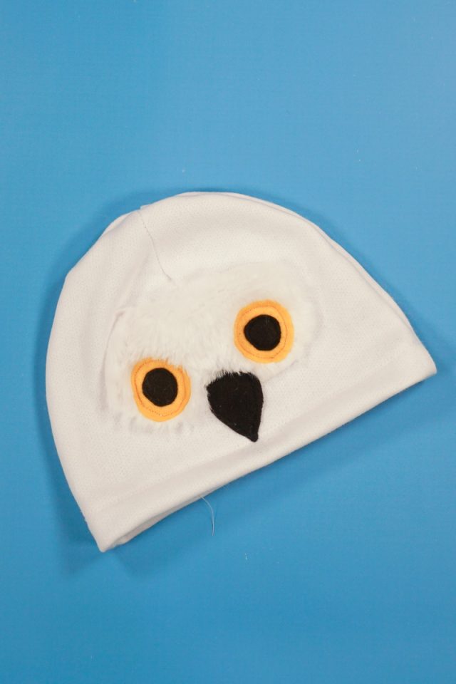 sew face details onto hat