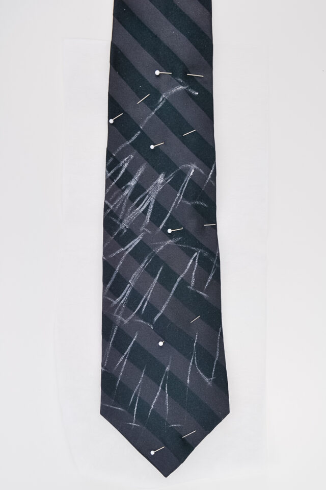 pin the tie to the stabilizer