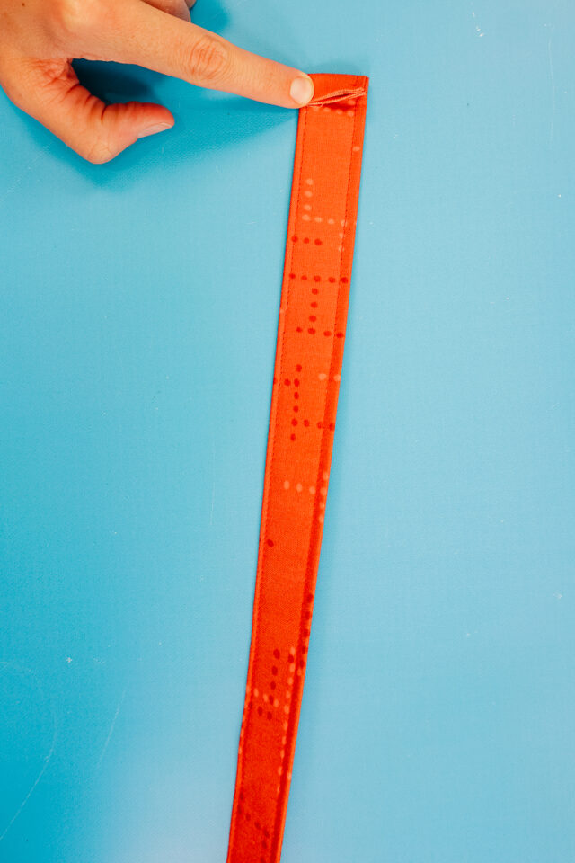 fold other short end under 3/8 inch