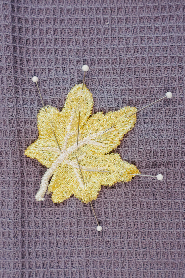 pin the patches onto the towel