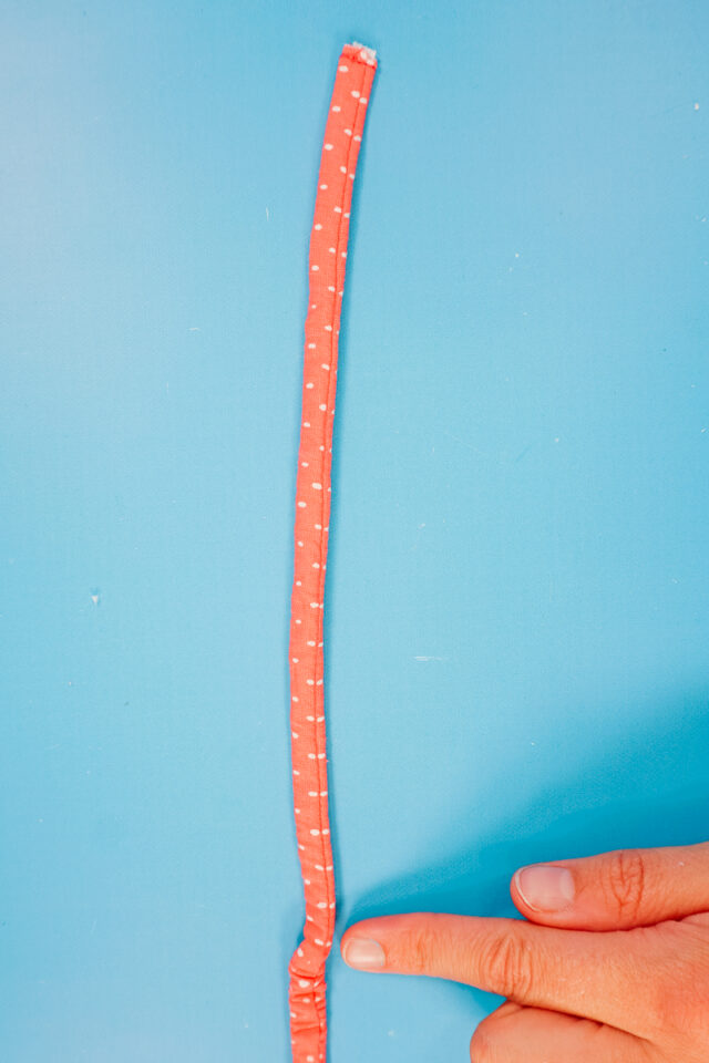 when the end of the elastic gets to the end of the tube, sew it in place