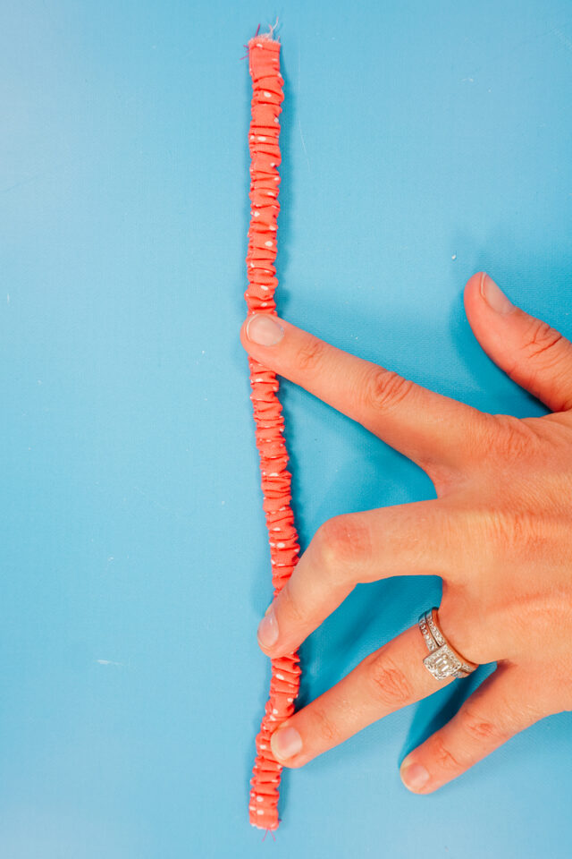tack the elastic on the other side of the tube