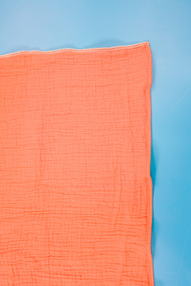 sew a 1/4 inch double fold hem on both short ends