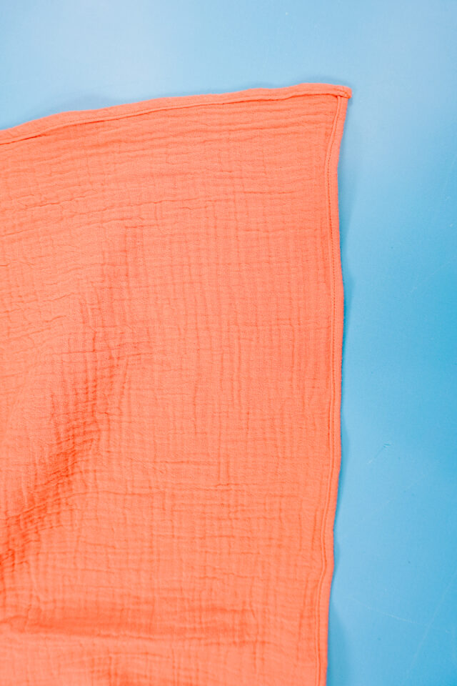 sew a 1/4 inch double fold hem on both long ends