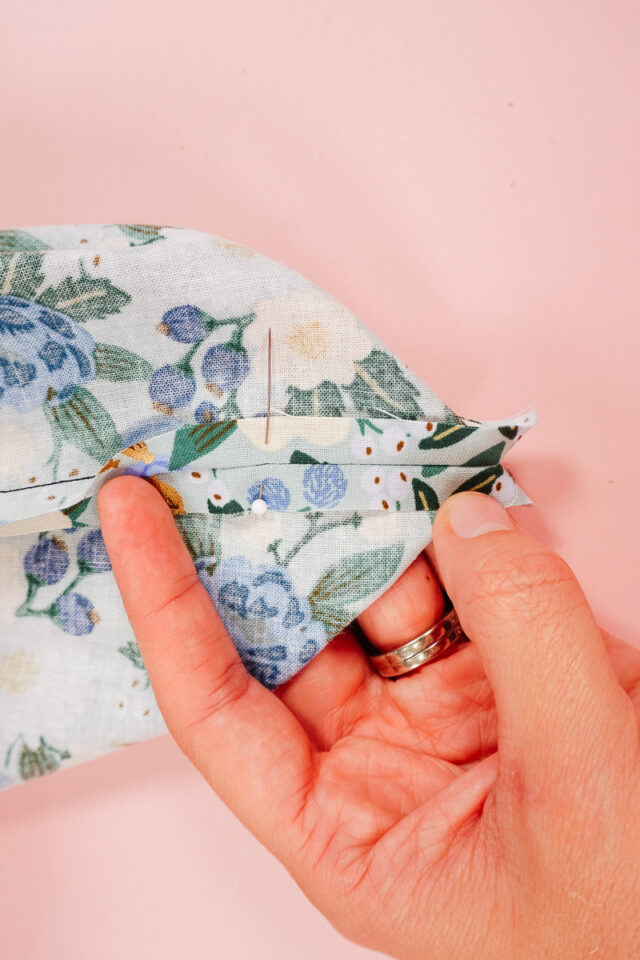 pin 2 inches away from corner