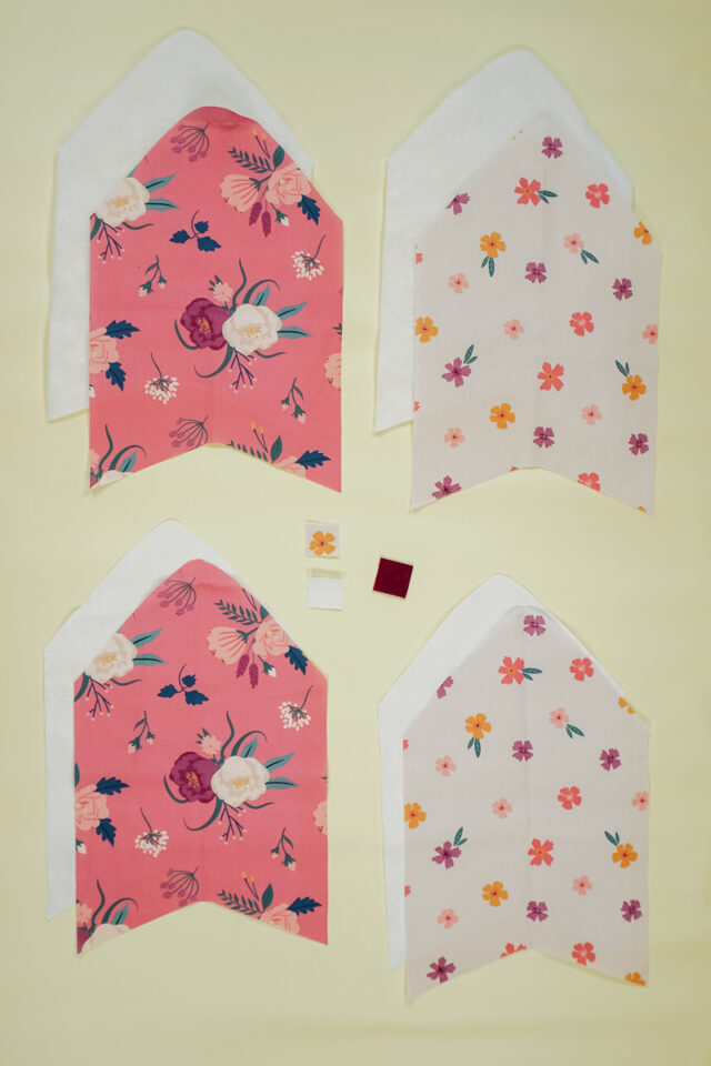 cut out fabric, fusible fleece, and interfacing
