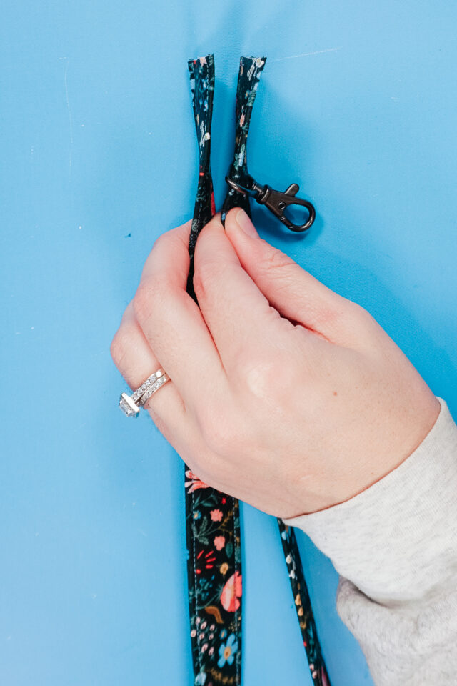 slide lobster claw onto lanyard