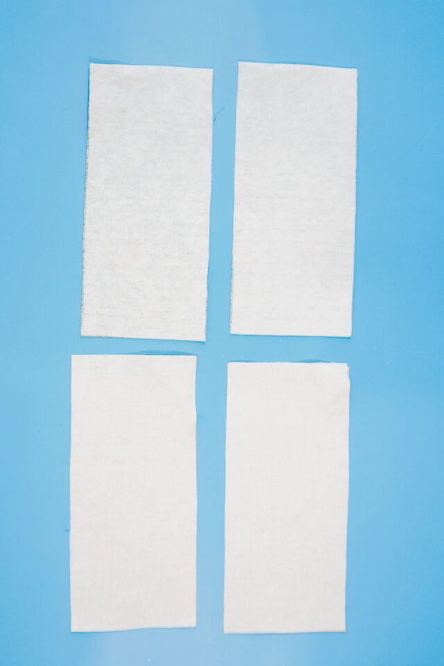 apply interfacing and fleece to the wrong side of the fabric