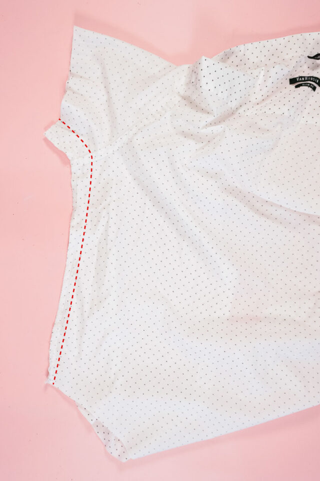 take the shirt in under the arms and and through the sleeves