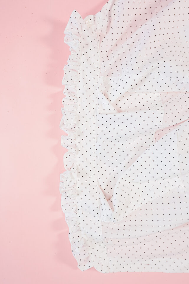 gather the hem into a ruffle and sew it into the collar