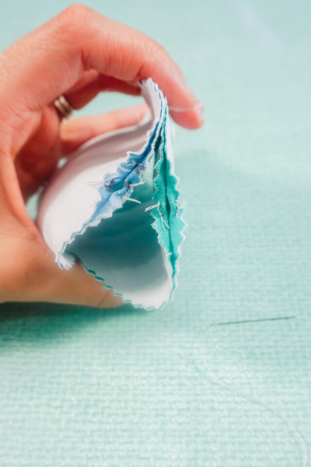 hand stitch the seam allowance open at the top hole
