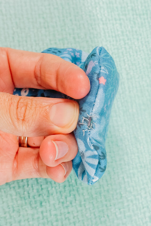 hand stitch the holes to line up