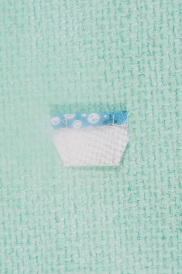 fold tab in half and sew ends