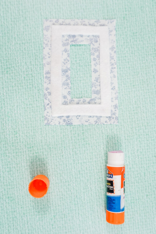 glue felt to the center of the window piece