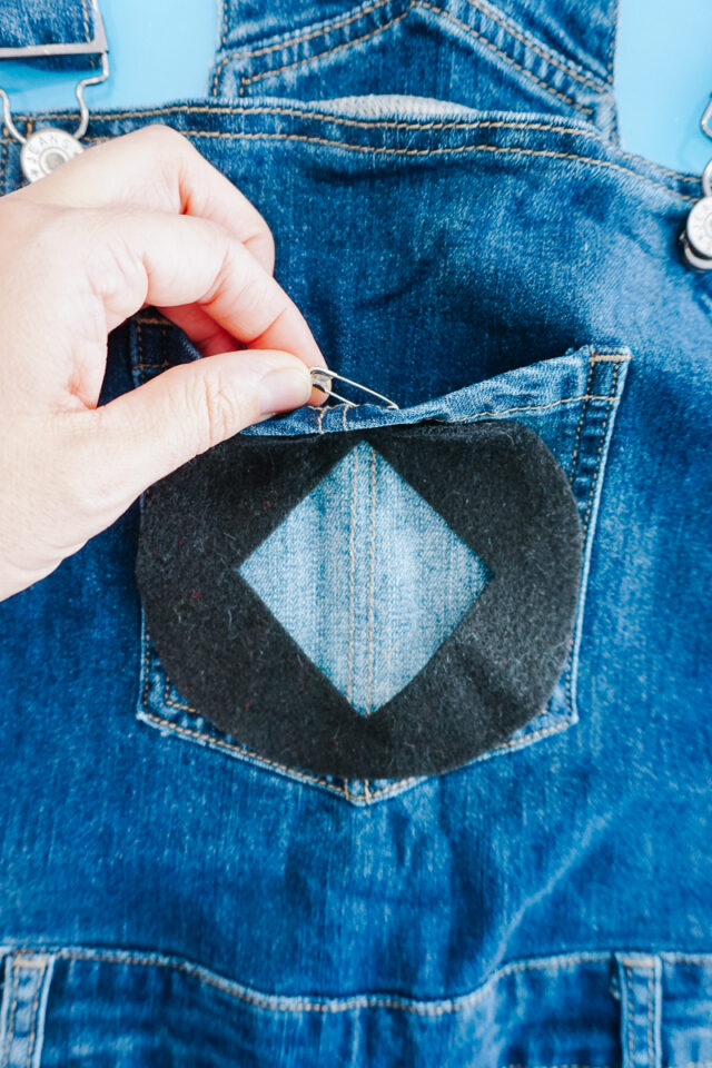 attach black felt pieces with safety pins