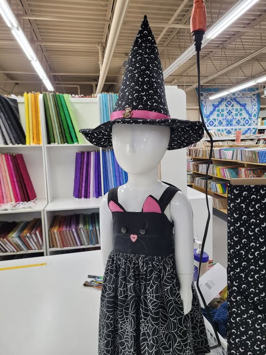 witch hat with pink ribbon