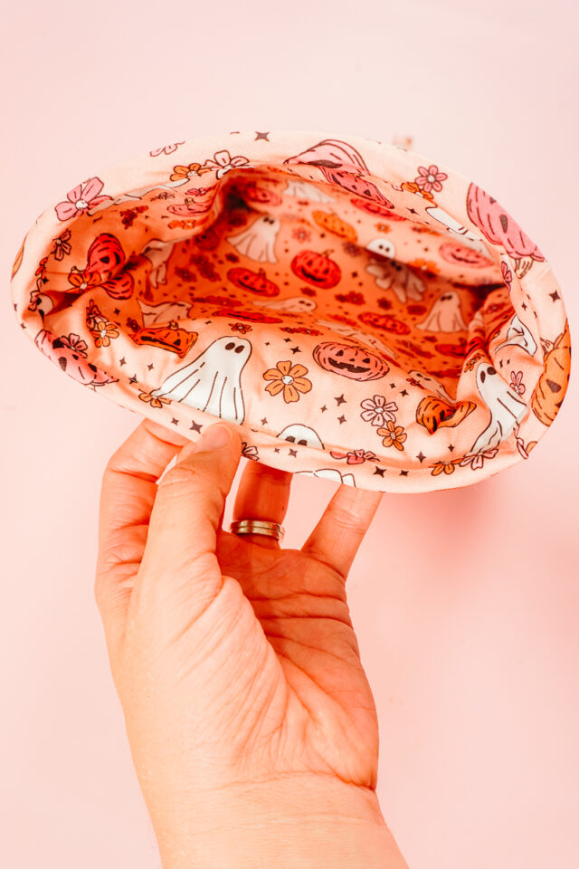 fold binding around the raw edges and sew in place