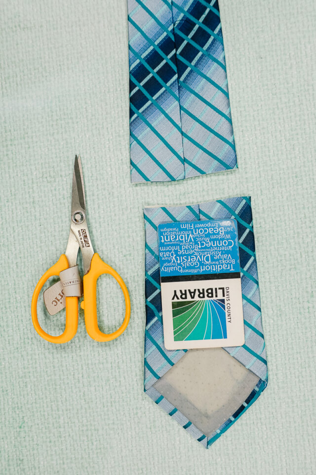 cut the thick end of the tie