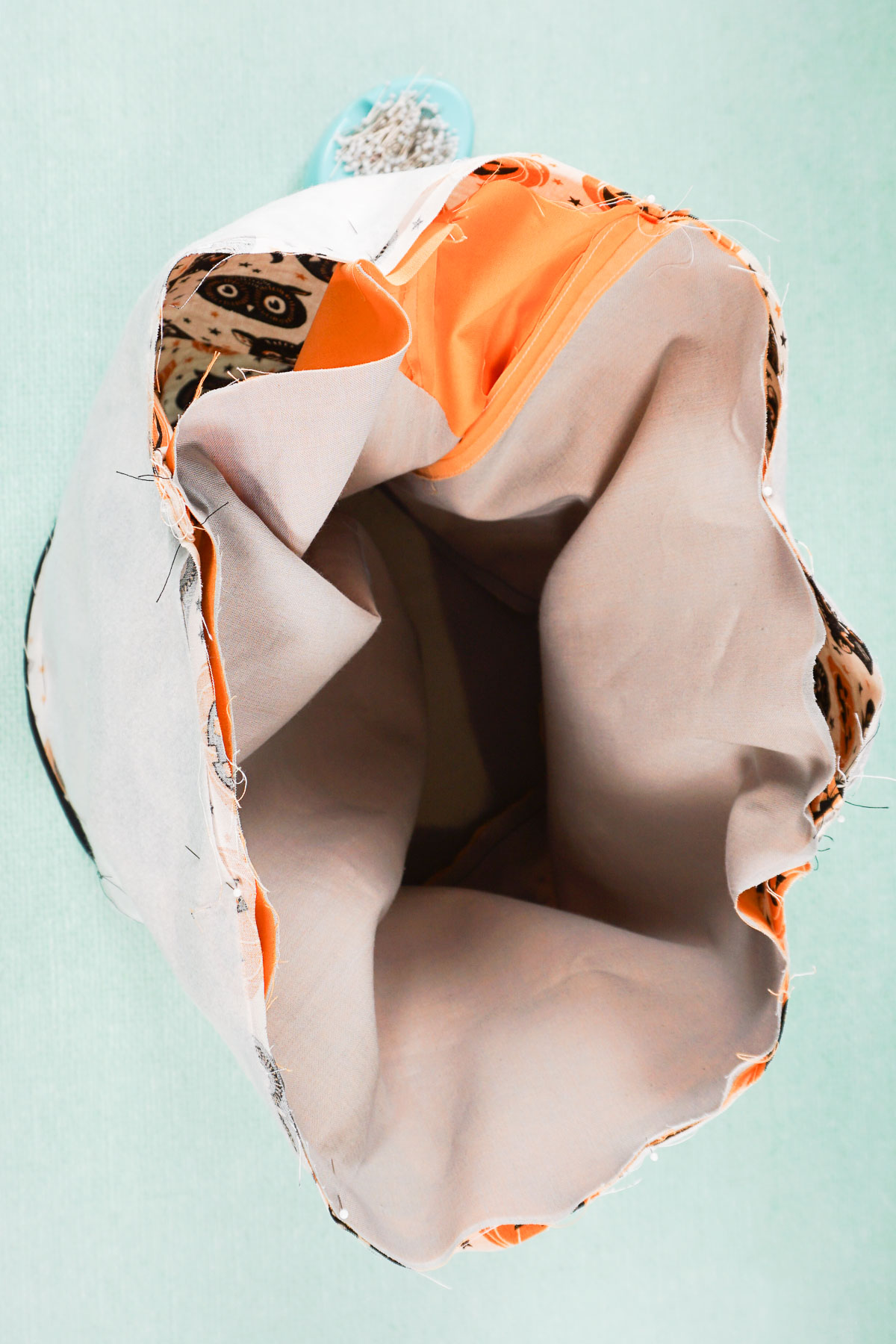 pin both buckets together around top edge and leave hole