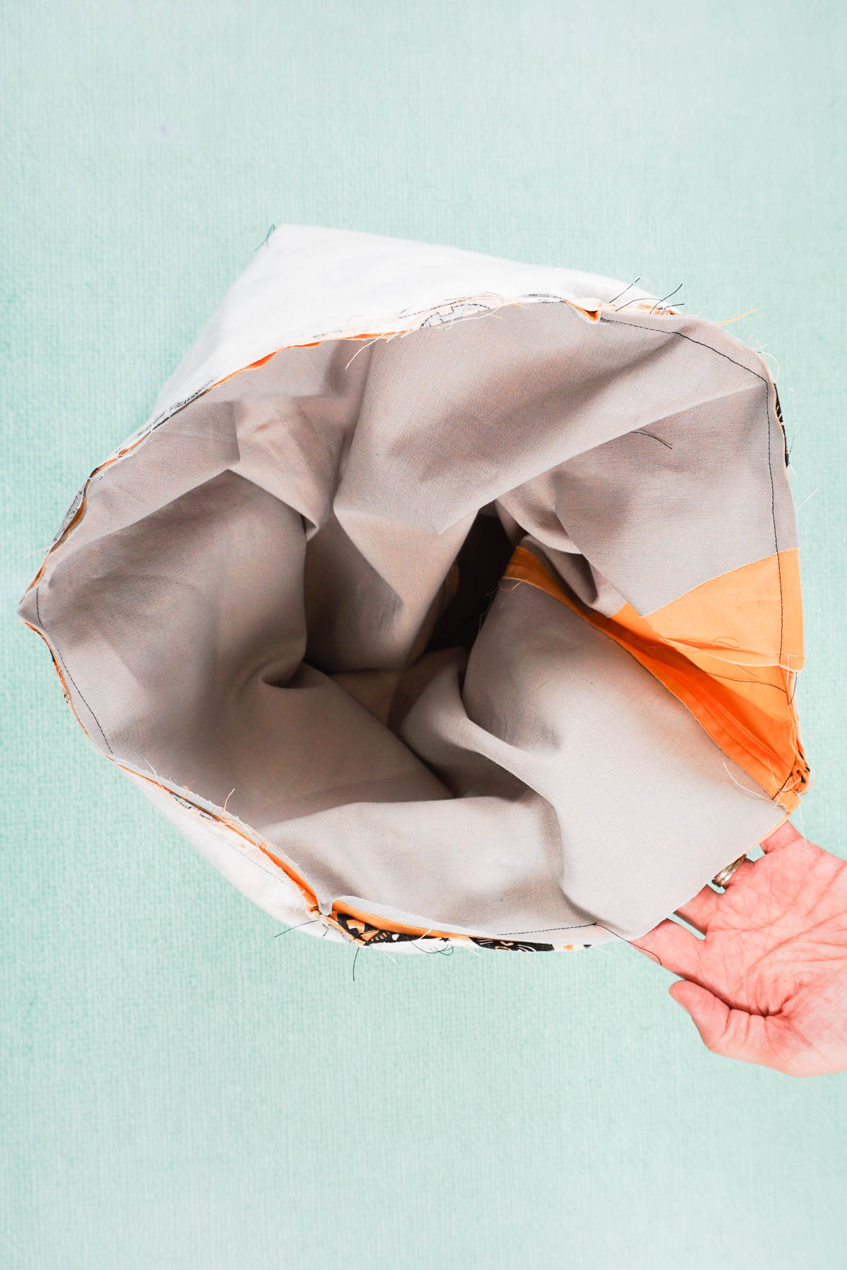 sew both buckets together around top edge and leave hole
