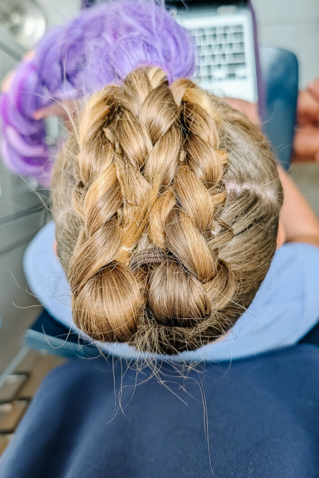 weave the braids under the upper braid and secure with bobby pins