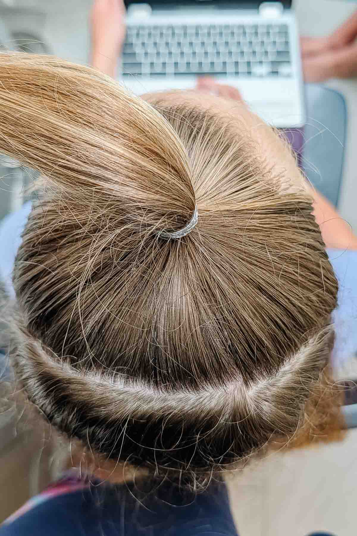 pull the top section into a ponytail