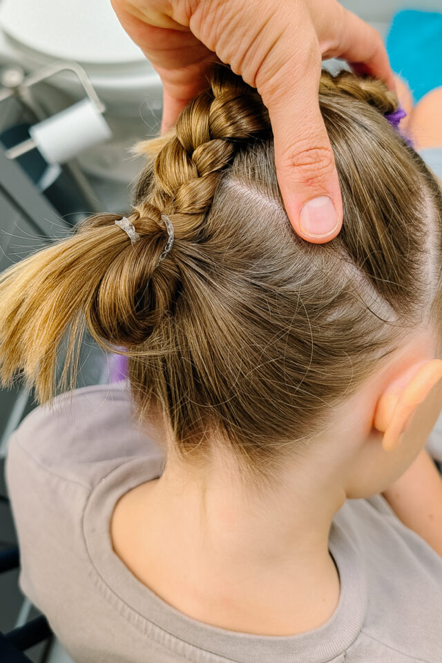 braid hair. combine braid and hair into bottom ponytail. do a pull through bun or a regular bun.