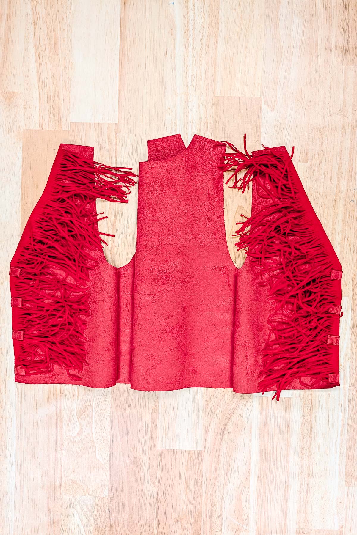 pin fringe and loops to front of vest