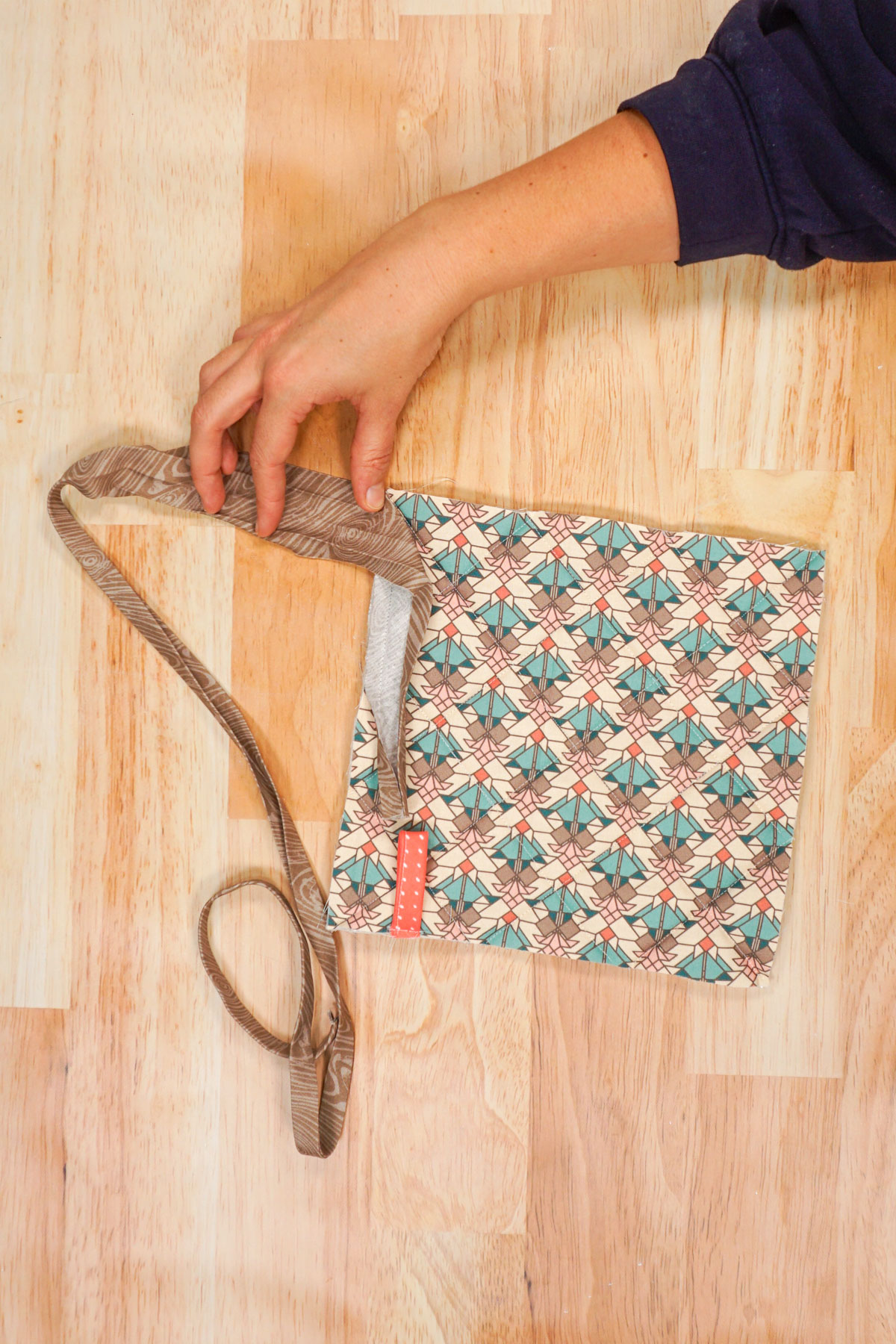 fold bias binding over perpendicular to the sew side